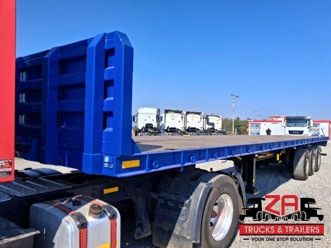2022 HENRED FREUHAUF TRI-AXLE FLAT DECK TRAILER