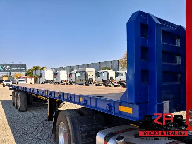 2022 HENRED FREUHAUF TRI-AXLE FLAT DECK TRAILER