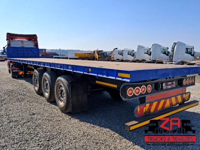 2022 HENRED FREUHAUF TRI-AXLE FLAT DECK TRAILER