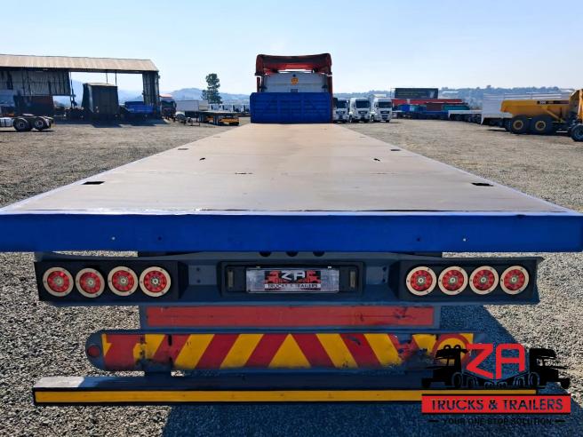 2022 HENRED FREUHAUF TRI-AXLE FLAT DECK TRAILER