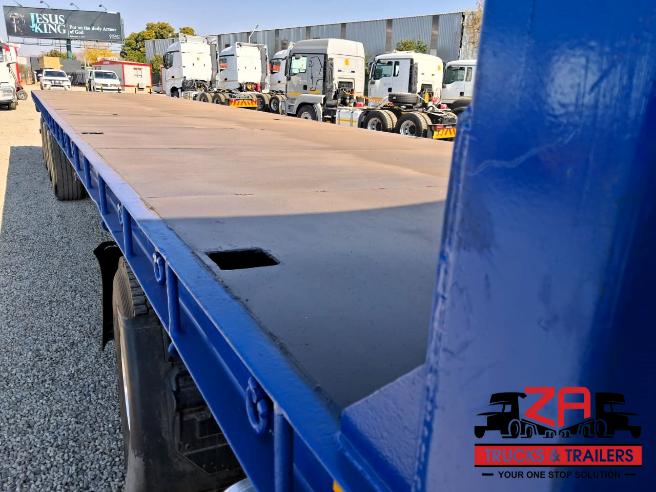 2022 HENRED FREUHAUF TRI-AXLE FLAT DECK TRAILER