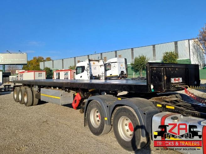 2025 PARAMOUNT TRI-AXLE FLAT DECK TRAILER