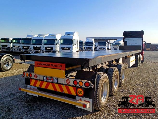 2025 PARAMOUNT TRI-AXLE FLAT DECK TRAILER