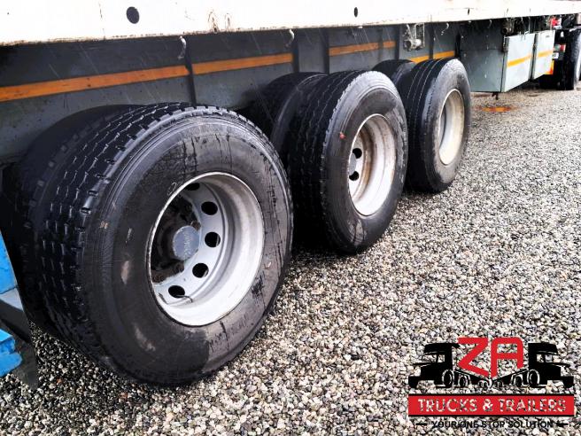 2013 PARAMOUNT TRI-AXLE FLAT DECK TRAILER