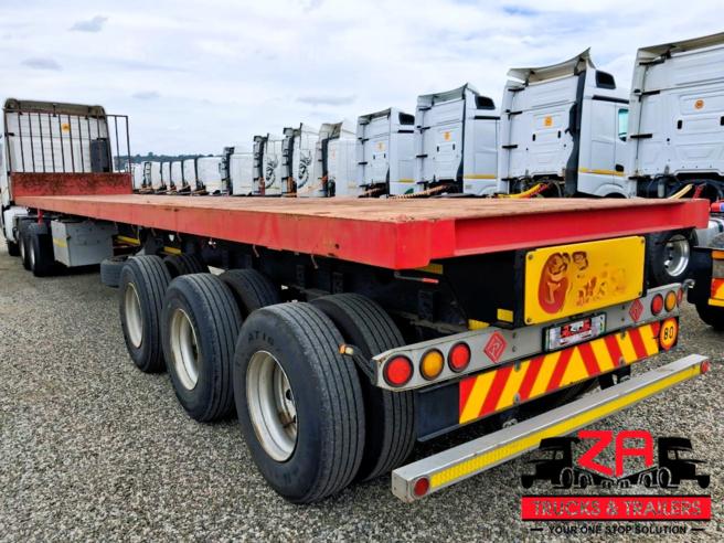 2022 PARAMOUNT TRI AXLE FLAT DECK TRAILER