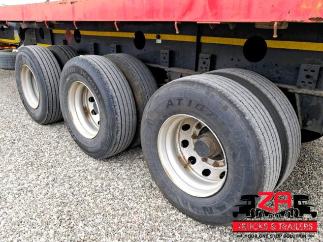 2022 PARAMOUNT TRI AXLE FLAT DECK TRAILER
