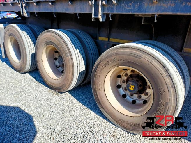 2023 HENRED FRUEHAUF TRI-AXLE DROPSIDE TRAILER