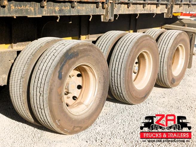 2023 HENRED FRUEHAUF TRI-AXLE DROPSIDE