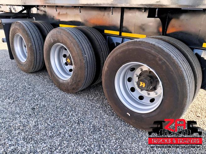 2021 HENRED FRUEHAUF TRI-AXLE FLAT DECK TRAILER