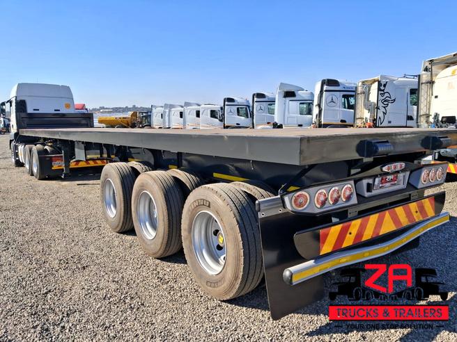 2021 HENRED FRUEHAUF TRI-AXLE FLAT DECK TRAILER