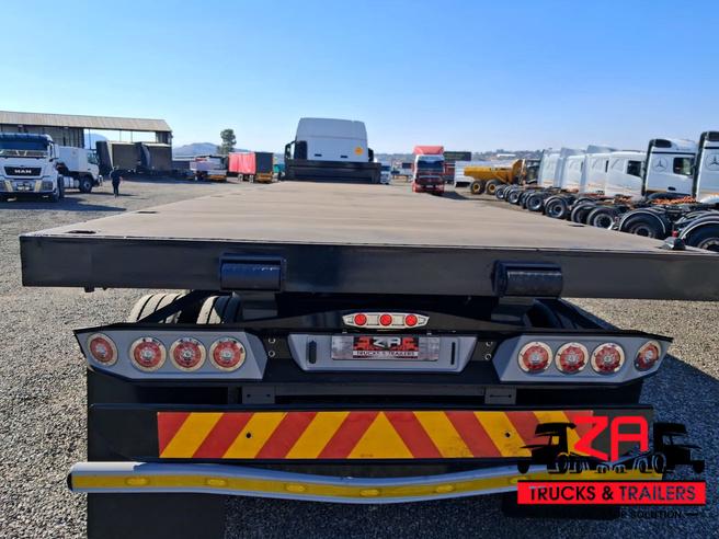 2021 HENRED FRUEHAUF TRI-AXLE FLAT DECK TRAILER