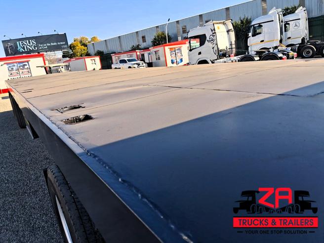 2021 HENRED FRUEHAUF TRI-AXLE FLAT DECK TRAILER
